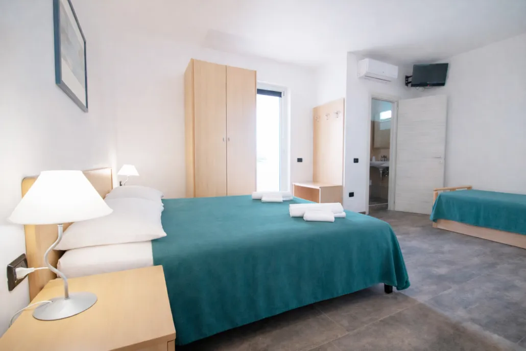 Camera tripla con letto matrimoniale, letto singolo e bagno privato